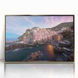 Framed acrylic wall art showcasing a serene village landscape with vibrant colors, set in a stylish gold frame, perfect for enhancing home decor.