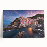 Stretched canvas artwork showcasing a vibrant village landscape with rolling hills and quaint houses, perfect for home decor. The colorful scene evokes a serene atmosphere.