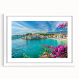 Framed landscape wall art design showcasing a serene village scene in soft pastel colors, accented with a white mat, ideal for home decor enhancement.