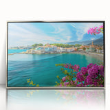 Framed wall art featuring a serene village landscape design with vibrant colors and intricate details, set in a sleek silver frame, perfect for home decor.