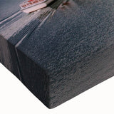 Close-up view of a vibrant stretched canvas wall art piece showcasing a serene village landscape with lush greenery and colorful houses, perfect for home decor.