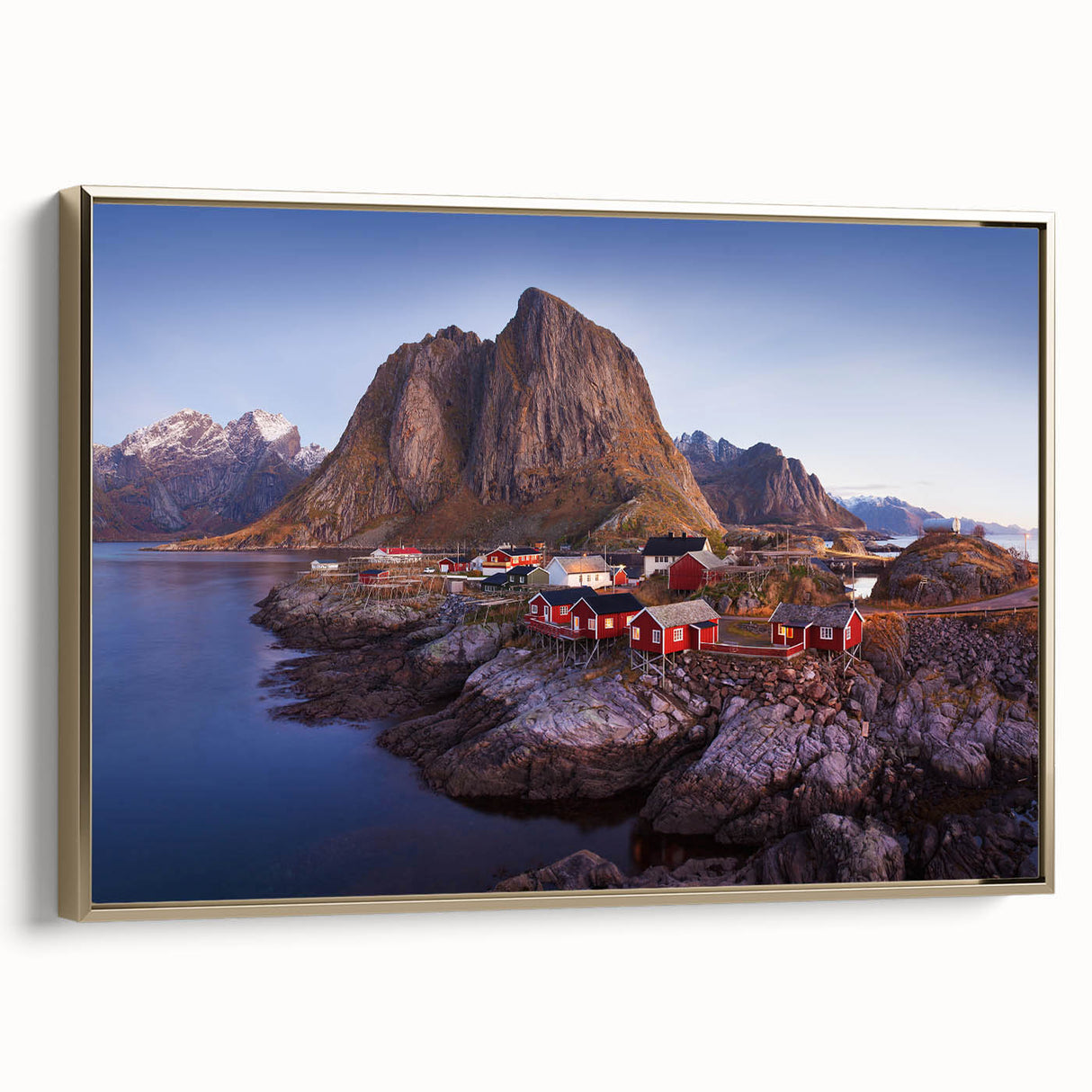 Framed canvas wall art showcasing a serene village landscape design with vibrant colors and intricate details, featuring a stylish gold frame that enhances its elegance.