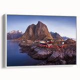 Framed canvas wall art showcasing a serene village landscape design with vibrant colors and intricate details, displayed against a white background for a modern touch.