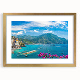 Framed gold wall art featuring a serene village landscape design, accented with a white mat, ideal for home decor and adding elegance to living spaces.