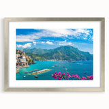 Framed wall art featuring a serene landscape village design, enclosed in a sleek silver frame with a white mat, ideal for home decor. Perfect for enhancing interior aesthetics.