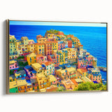 Framed canvas artwork showcasing a scenic village landscape with vibrant colors and gold accents, perfect for home decor. The piece exudes warmth and charm, ideal for enhancing interior spaces.