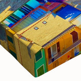 Close-up of a stretched canvas wall art piece showcasing a serene village landscape design, featuring vibrant colors and intricate details, perfect for home decor.