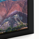 Close-up of a framed canvas wall art piece showcasing a vibrant village landscape design, featuring lush greenery and colorful homes, ideal for enhancing interior decor.