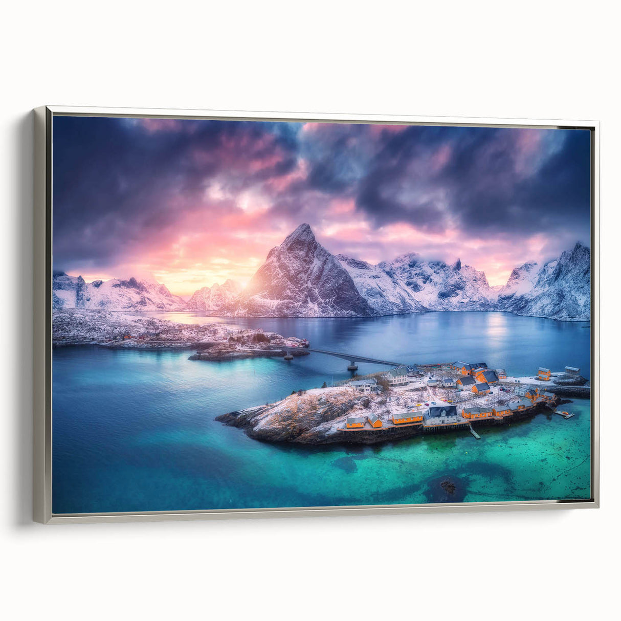 Framed canvas wall art showcasing a serene village landscape in soft earth tones, accented with a silver frame, ideal for home decor. This elegant piece adds a touch of tranquility to any space, blending nature and art seamlessly.