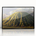 Framed acrylic wall art showcasing a dramatic volcano landscape design in vibrant colors, set against a sleek black frame, ideal for modern home decor.