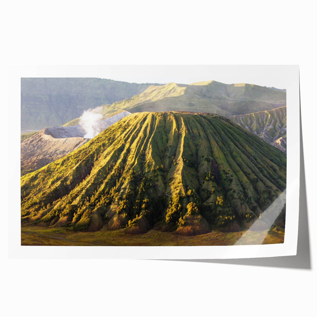 Colorful rolled print of a vibrant volcano landscape design, showcasing dramatic lava flows and a vivid sunset, ideal for home decor or art collection.