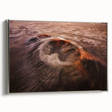 Framed canvas wall art showcasing a vibrant volcano landscape design, featuring rich colors and dynamic textures, elegantly displayed with a sleek silver frame.