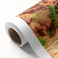 Serene landscape wall art featuring a picturesque waterfall cascading over rocks, surrounded by lush greenery on a rolled canvas print, perfect for home decor.