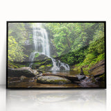 Framed wall art featuring a stunning waterfall landscape design with vibrant colors, set in a sleek black frame, ideal for enhancing home decor.