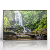Framed acrylic wall art featuring a serene waterfall landscape design, highlighting vibrant colors and intricate details, perfect for home decor enhancement.