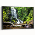 Framed canvas wall art showcasing a picturesque waterfall landscape with vibrant colors, set in a sleek black frame, perfect for enhancing home decor.