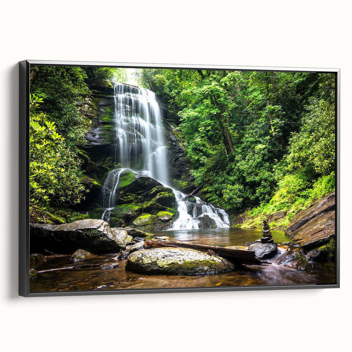 Framed canvas wall art showcasing a picturesque waterfall landscape with vibrant colors, set in a sleek black frame, perfect for enhancing home decor.