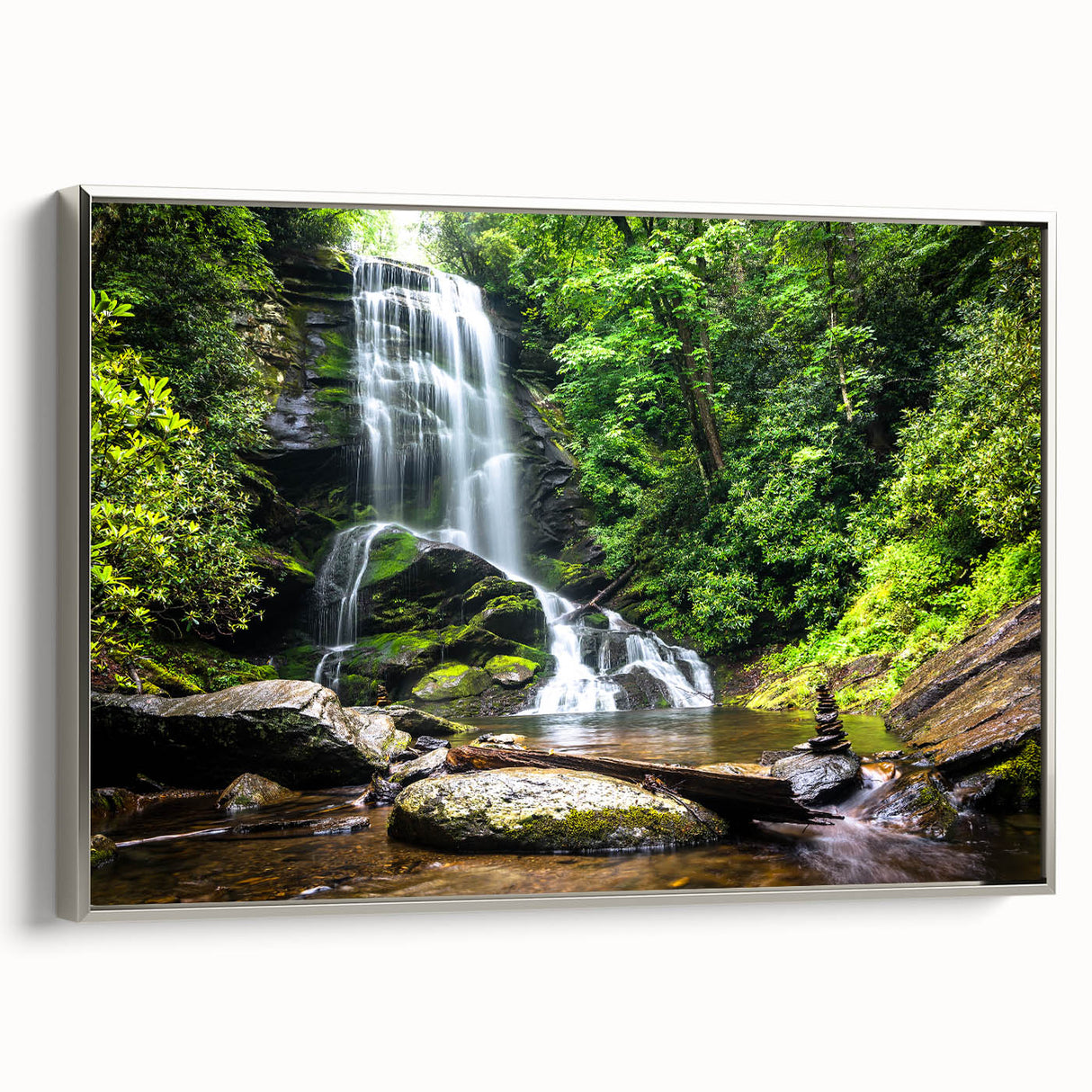 Framed canvas wall art showcasing a serene landscape waterfall, elegantly bordered in silver, perfect for home decor and nature lovers. Ideal for enhancing interior spaces.