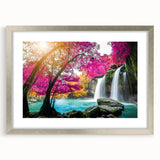 Framed wall art featuring a serene waterfall landscape design surrounded by a silver mat, ideal for home decor, enhancing ambiance with nature's beauty.