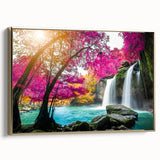 Framed canvas wall art showcasing a serene waterfall landscape in vibrant colors, accented with a gold frame, ideal for home decor and interior design.
