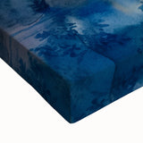 Close-up of a vibrant stretched canvas wall art piece showcasing a serene waterfall surrounded by lush greenery, perfect for home decor and nature lovers.