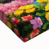 Close-up of a vibrant stretched canvas wall art piece depicting a serene waterfall landscape, showcasing rich blues and greens, perfect for home decor enthusiasts.