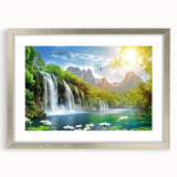 Framed wall art print showcasing a serene waterfall landscape, featuring vibrant blues and greens. The silver frame with mat adds elegance, perfect for home decor.