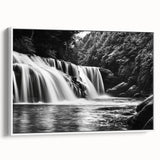 Framed canvas wall art displaying a serene waterfall landscape with vibrant greenery and a natural setting, perfect for home decor in a white frame.