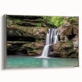 Framed canvas wall art showcasing a serene waterfall landscape, highlighting vibrant blues and greens, with a sleek silver frame, ideal for home decor.
