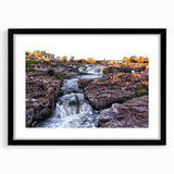 Framed black wall art featuring a serene landscape of cascading waterfalls, set against lush greenery, ideal for enhancing any modern home decor.