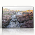 Framed acrylic wall art showcasing a stunning waterfall landscape design with vibrant colors, set in a sleek black frame, perfect for enhancing home décor.