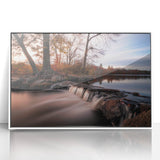 Framed wall art showcasing a serene waterfall landscape in vibrant colors, set in a sleek white frame, ideal for modern home decor and nature enthusiasts.