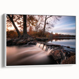 Framed canvas wall art showcasing a serene waterfall landscape with vibrant colors, displayed from a side view against a white background, perfect for home decor.