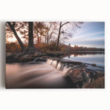 Stretched canvas wall art showcasing a vibrant waterfall landscape design with lush greenery and cascading water, perfect for enhancing home decor.