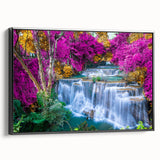 Framed canvas wall art showcasing a vibrant waterfall landscape design with lush greenery and flowing water, featuring a sleek black frame for modern decor.
