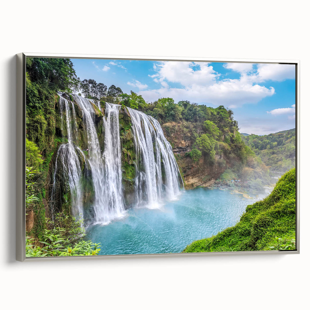 Framed canvas wall art showcasing a serene waterfall landscape design with silver accents, perfect for home decor. The artwork captures vibrant colors and natural beauty, enhancing any interior space.