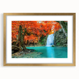 Framed wall art collection showcasing a serene landscape with a cascading waterfall, surrounded by lush greenery, presented in an elegant gold frame with a mat for added sophistication. Perfect for enhancing home decor with a touch of nature's beauty.