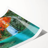 Serene landscape wall art depicting a vibrant waterfall surrounded by lush greenery, printed on high-quality material and rolled for easy display. Perfect for nature lovers.
