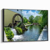 Framed canvas wall art showcasing a serene watermill landscape design, featuring lush greenery and a tranquil water scene, with a sleek black frame enhancing its elegance. Perfect for home decor.