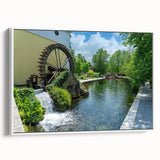 Framed canvas wall art showcasing a serene landscape of a watermill, featuring soft colors and intricate details, displayed in a stylish white frame. Ideal for enhancing home decor.