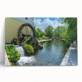 Stretched canvas artwork depicting a serene watermill landscape, showcasing vibrant colors and intricate details, perfect for home decor and nature lovers.