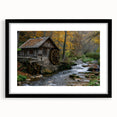 Framed wall art collection showcasing a serene watermill landscape design, featuring a sleek black frame with a white mat, ideal for enhancing home decor.