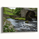 Framed canvas wall art showcasing a serene watermill landscape design with silver accents, ideal for home decor, set against a neutral background.