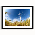 Black-framed wall art featuring a serene landscape with windmills, presented with a mat for an elegant finish, perfect for enhancing home decor aesthetics.