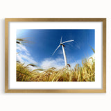 Framed wall art featuring a serene landscape with windmills, set in a gold frame with a mat, showcasing a harmonious blend of nature and design. Perfect for home decor.