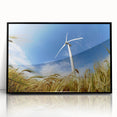 Framed acrylic wall art featuring a serene landscape with windmills, set against a vibrant sunset; sleek black frame enhances the artwork's modern appeal.