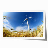 Vibrant rolled print of a serene landscape featuring windmills against a colorful sunset sky, showcasing artistic details and textures for home decor enhancement.