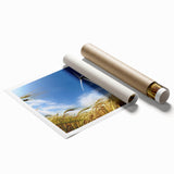 Vibrant rolled print of a serene landscape featuring windmills under a blue sky, ideal for home decor or office art, showcasing detailed colors and textures.