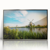 Framed wall art collection featuring a serene landscape with windmills, designed in an elegant silver frame, perfect for home decor enhancement.