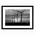 Black-framed wall art showcasing a serene landscape with windmills, designed with a modern aesthetic and featuring a white mat to enhance its elegance. This piece adds a touch of sophistication to any interior decor.